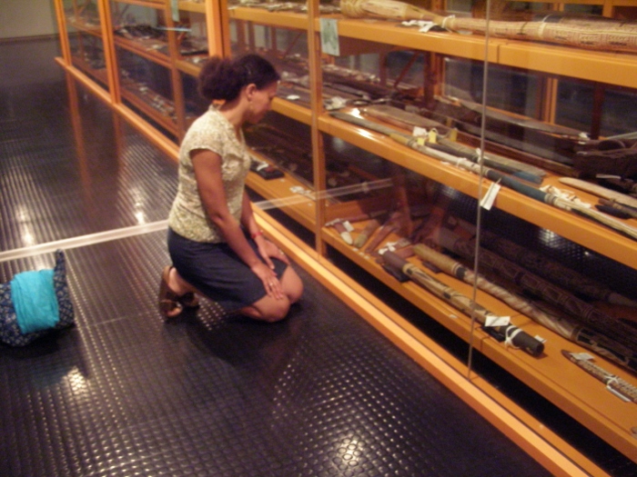 Wonu viewing the objects collected by van der Leeden at the National Museum of Australia